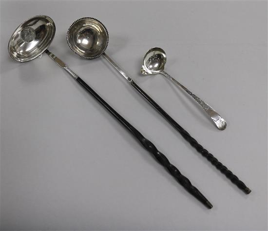 A Scottish silver toddy ladle, Edinburgh 1804 and two Georgian toddy ladles